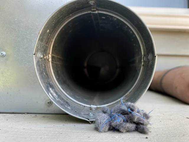East Bridgewater Dryer Vent Cleaning technician using specialized equipment to clear severe dryer vent blockage in East Bridgewater